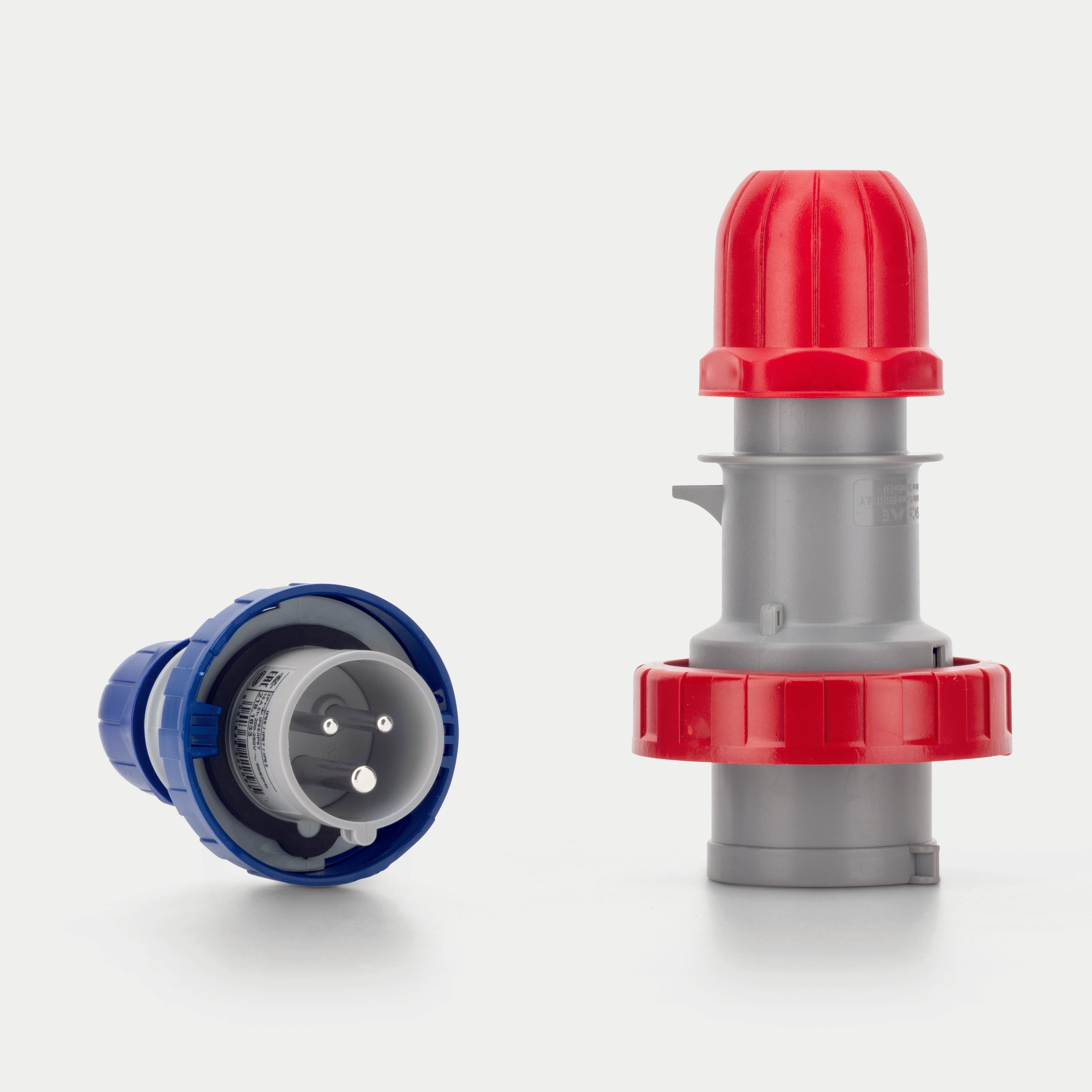 Three cee form connectors with red, blue, and gray bodies on a white background